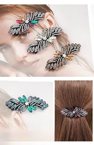 Macro detail of alloy hair clip with colorful rhinestones in a butterfly wing design