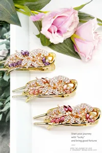 Macro view of crystal flower hair clips with vintage rhinestone and metal floral details