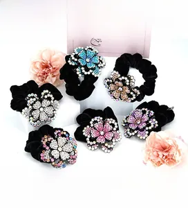 Detail of Korean velvet scrunchies with large rhinestone peony flower embellishments
