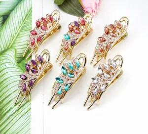 Close-up of elegant flower hair clips with colorful rhinestones and gold plating