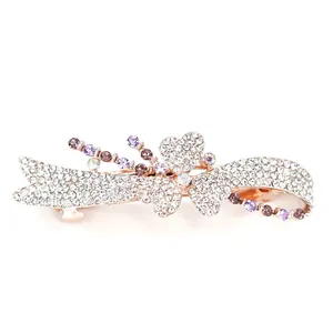 Elegant rose gold spring hair clip featuring purple crystals and sparkling rhinestones