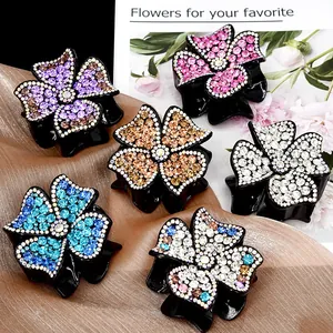 Set of 6 elegant floral hair claws featuring colorful rhinestones in multiple vibrant shades