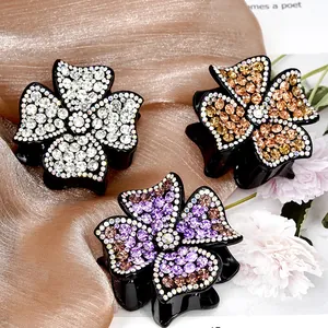 Sparkling rhinestone four-leaf flower hair claws in white, champagne and purple colors
