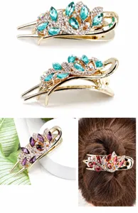 Detail of floral hair clip with rhinestones and crystals in blue, purple, and red colors