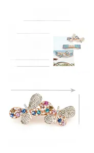Macro shot of rose gold alloy spring hair clip with sparkling rhinestones details