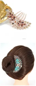 Detail of vintage peacock hair comb with rhinestones and elegant gold-plated alloy finish
