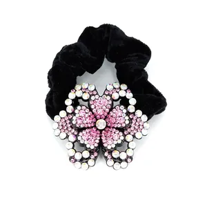Velvet peony scrunchie with sparkling pink and white rhinestones on white background