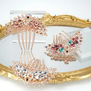 Retro peacock hair combs with rhinestones in three colors on a mirror surface