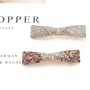 Elegant bow hair clips with shimmering rhinestones in white and colorful crystal designs