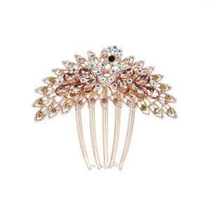 Vintage peacock hair comb with rose gold alloy plating and amber colored rhinestones