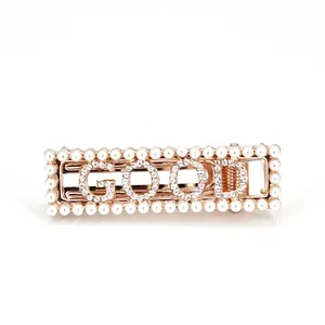 Sparkling rhinestone GOOD letter hair clip with pearl trim on rose gold base