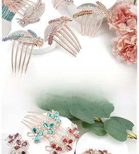 Detailed macro of rose gold floral hair comb with colorful rhinestones and leaf pattern