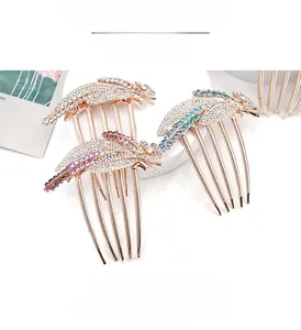 Detailed view of three crystal leaf hair combs in rose gold plating with 9cm width