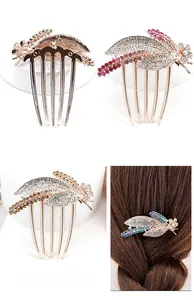 Detail of vintage gold alloy hair comb with colorful crystals and floral leaf design