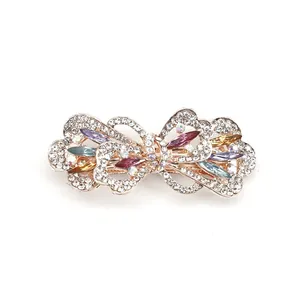 Elegant bow-shaped hair clip with colorful rhinestones and rose gold metal finish