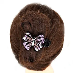 Pinza para el pelo vintage de mariposa con pedrería morada y cristales en base negra