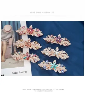 Detailed view of luxury flower hair clips with colorful crystals and sparkling rhinestones