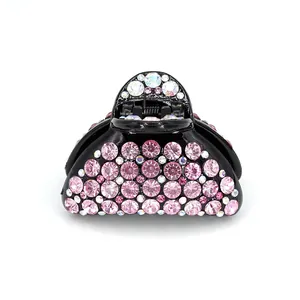 Petite pince à cheveux en demi-lune avec strass roses sur résine noire