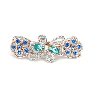 Elegante fermaglio a farfalla dorato con cristalli blu e strass per acconciatura sposa