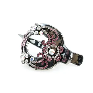 Elegant daisy floral hair clip with pink crystals and gunmetal finish on white background