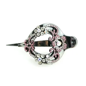 Daisy heart hair clip with pink rhinestones and vintage metal floral pattern on white