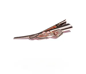 Detailed view of rose gold leaf hair clip with pink rhinestones and crystal accents