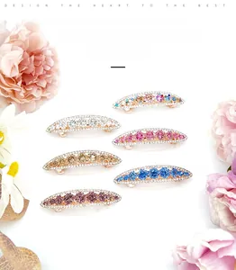 Close-up of elegant rhinestone spring hair clips in six colors with floral crystal details