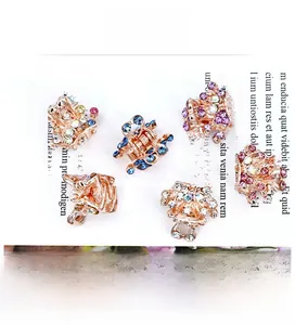 Close-up of 6-piece crown mini hair claw set with sparkling colorful rhinestones