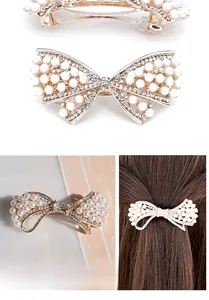 Détails d'une pince à cheveux nœud faite main avec perles, cristaux et fermoir ressort