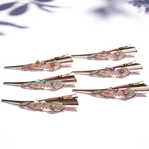 Elegant six-piece set of gold metal hair clips with colorful crystals and rhinestones