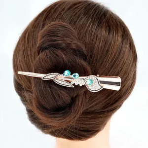 Floral crystal hair clip with blue water-drop gems on elegant rose gold metal base