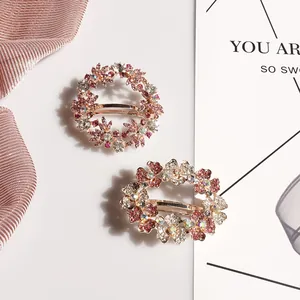 Floral crystal hair clips with pink rhinestones and gold plating for wedding hairstyles