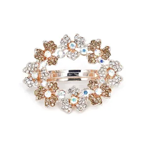 Exquisite rose gold floral spring hair clip with shimmering crystals for wedding hairstyles