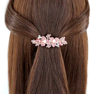 Barrette fleurie élégante en or rose avec cristaux roses et perles pour le mariage