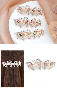 Detail of floral crystal spring hair clip with hollow alloy design and rhinestone inlay