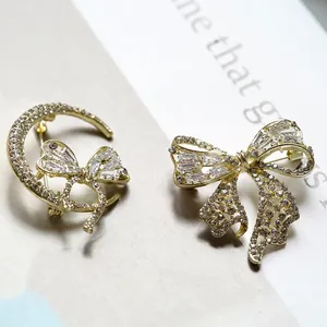 Ensemble de broches dorées élégantes avec lune et nœud, ornées de strass brillants