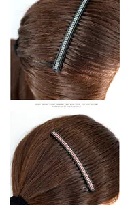 Close-up of sparkling blue and pink rhinestone hair combs on elegant brown hair