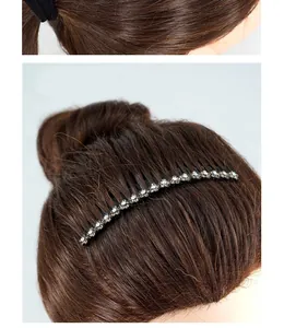 Detail of vintage flower iron hair comb with sparkling crystals for elegant bun styling