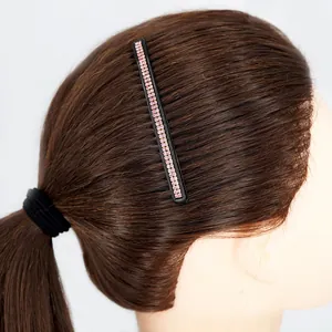 Rectangle hair clip with two rows of pink rhinestones on a black base for hairstyling