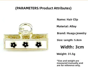 Golden alloy claw clip with black floral design and size dimensions of 5.8cm by 3cm