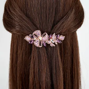 Pince à cheveux élégante en or rose avec cristaux violets et motif floral