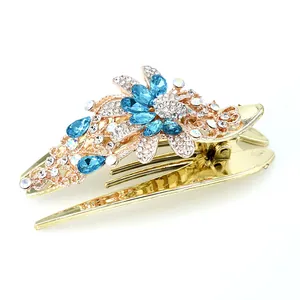 Eleganter goldener Blumen-Haarclip mit blauen Kristallen und weißen Strasssteinen