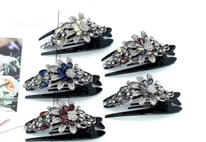 Detail view of five crystal flower hair claws in multiple colors with elegant rhinestone finish