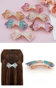 Détail de grandes barrettes nœud en strass avec pince à ressort en alliage de diverses couleurs