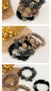 Detail view of mesh scrunchies with rhinestone balls in black, coffee, and grey tones