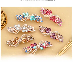 Detail view of large spring hair clips set with sparkling rhinestones in six colors