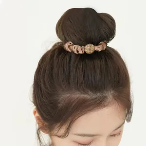 Elegant light brown satin hair scrunchie with a sparkling gold rhinestone ball detail