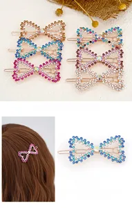 Close-up of sparkling rhinestone bow hair clip showing elegant craft and colors