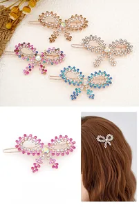 Detail view of sparkling rhinestone bow hair clips in champagne gold and silver colors