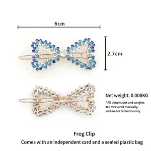Cute bow hair clip with blue rhinestones and gold base, size 6cm by 2.7cm, elegant hair accessory